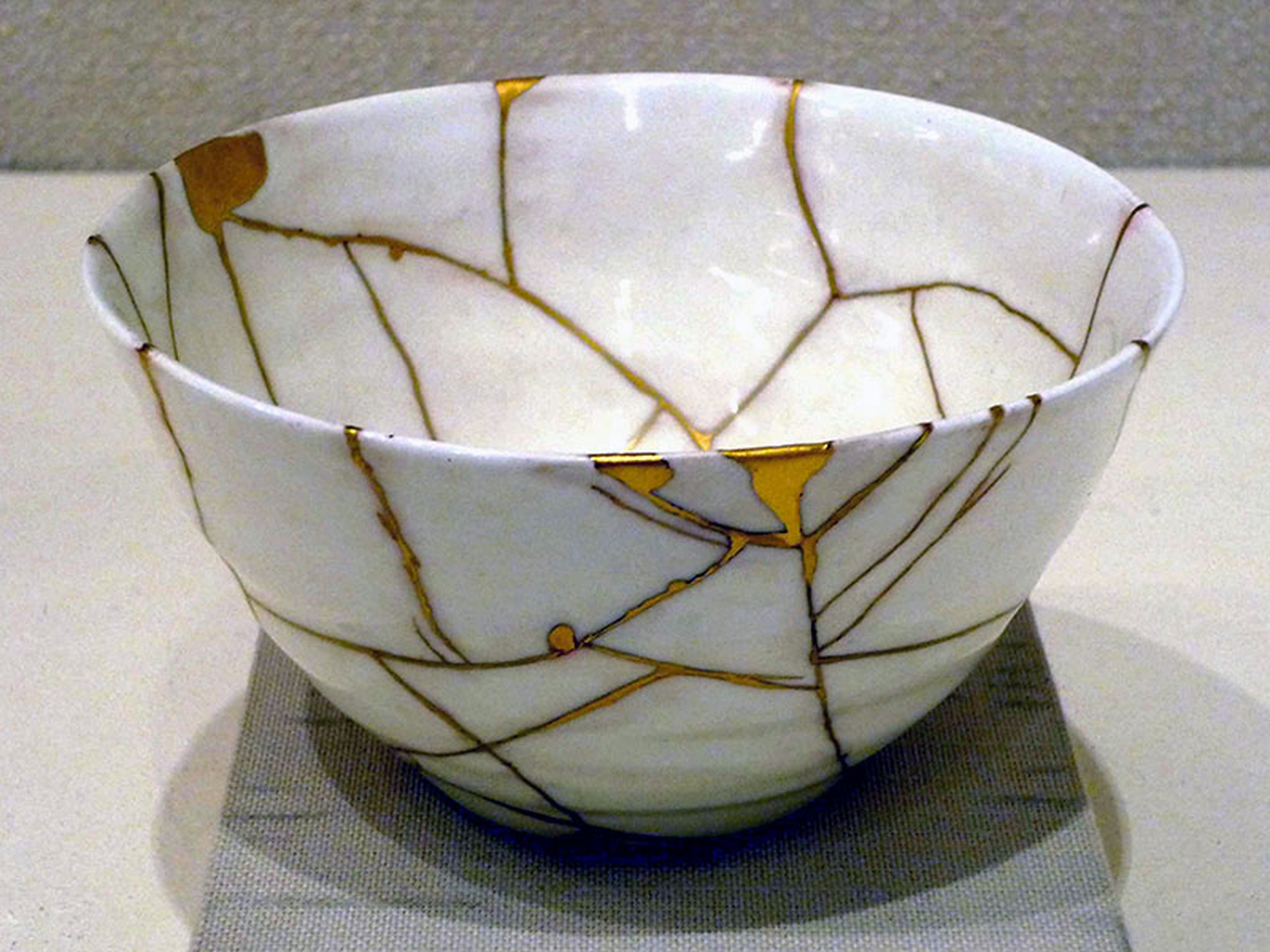 Grey Kintsugi vessel with gold seams